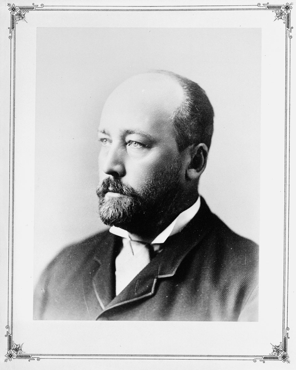 A black and white photo of a man with a beard at the Canadian Museum of History in Ottawa.