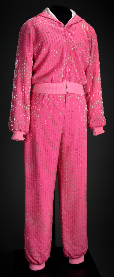 A pink jogging suit with many shiny beads creating vertical stripes.