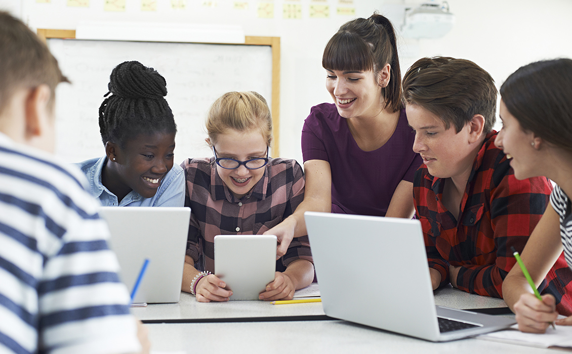 Teenage students with teacher