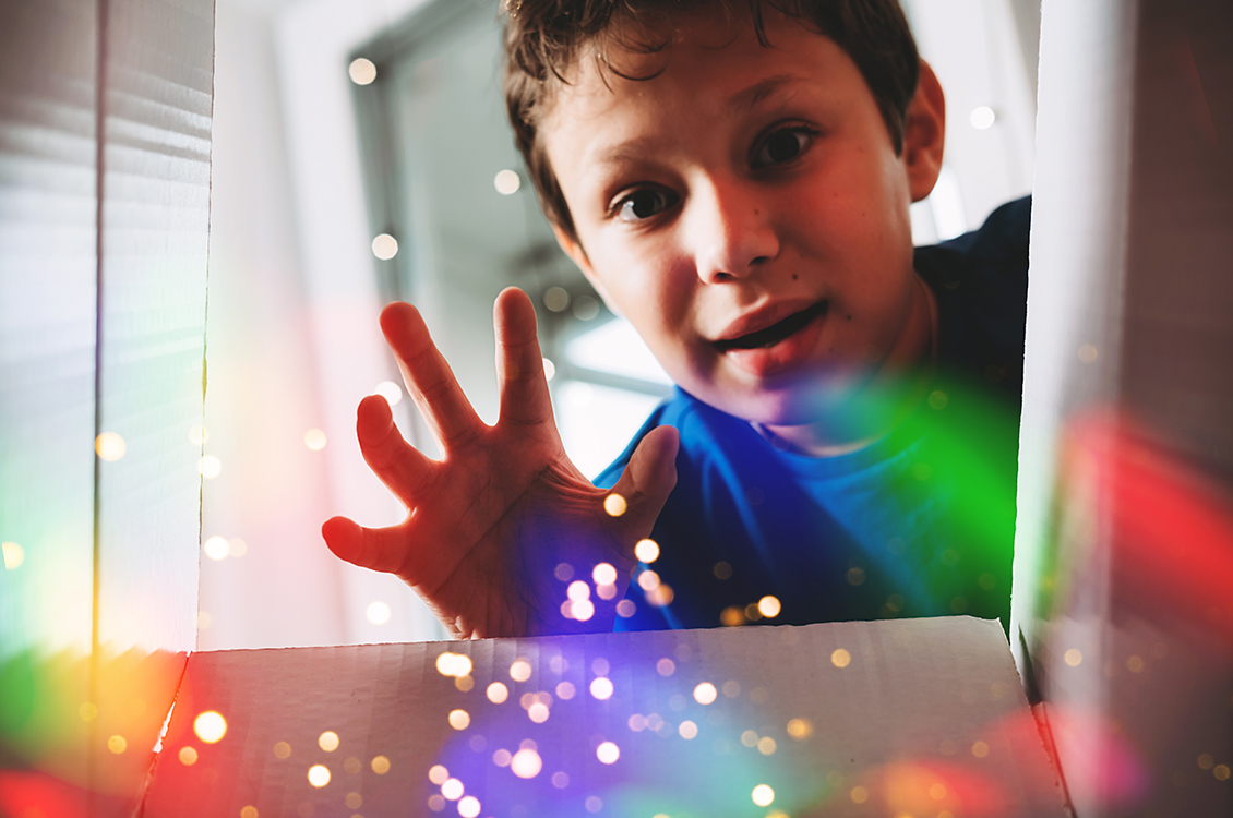 A boy looking at coloured lights