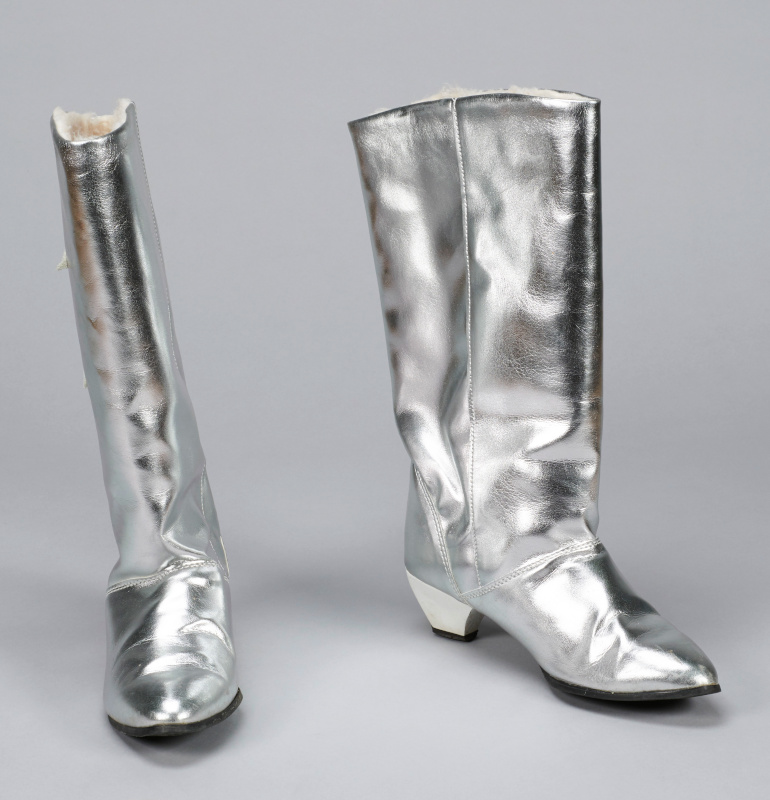 A pair of bright silver-coloured cowboy boots.