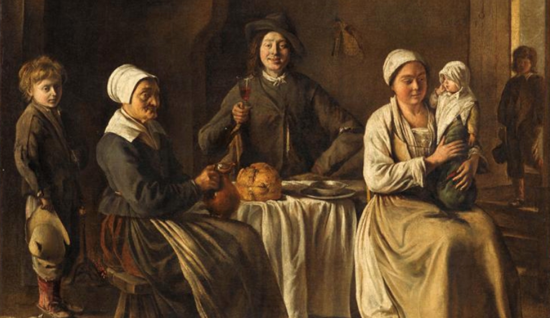 Peinture d’une famille assise autour d’une table avec du pain et du vin au xviiie.