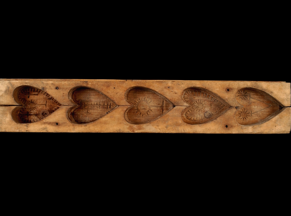 Picture of wooden sugar mould with hearts carved out