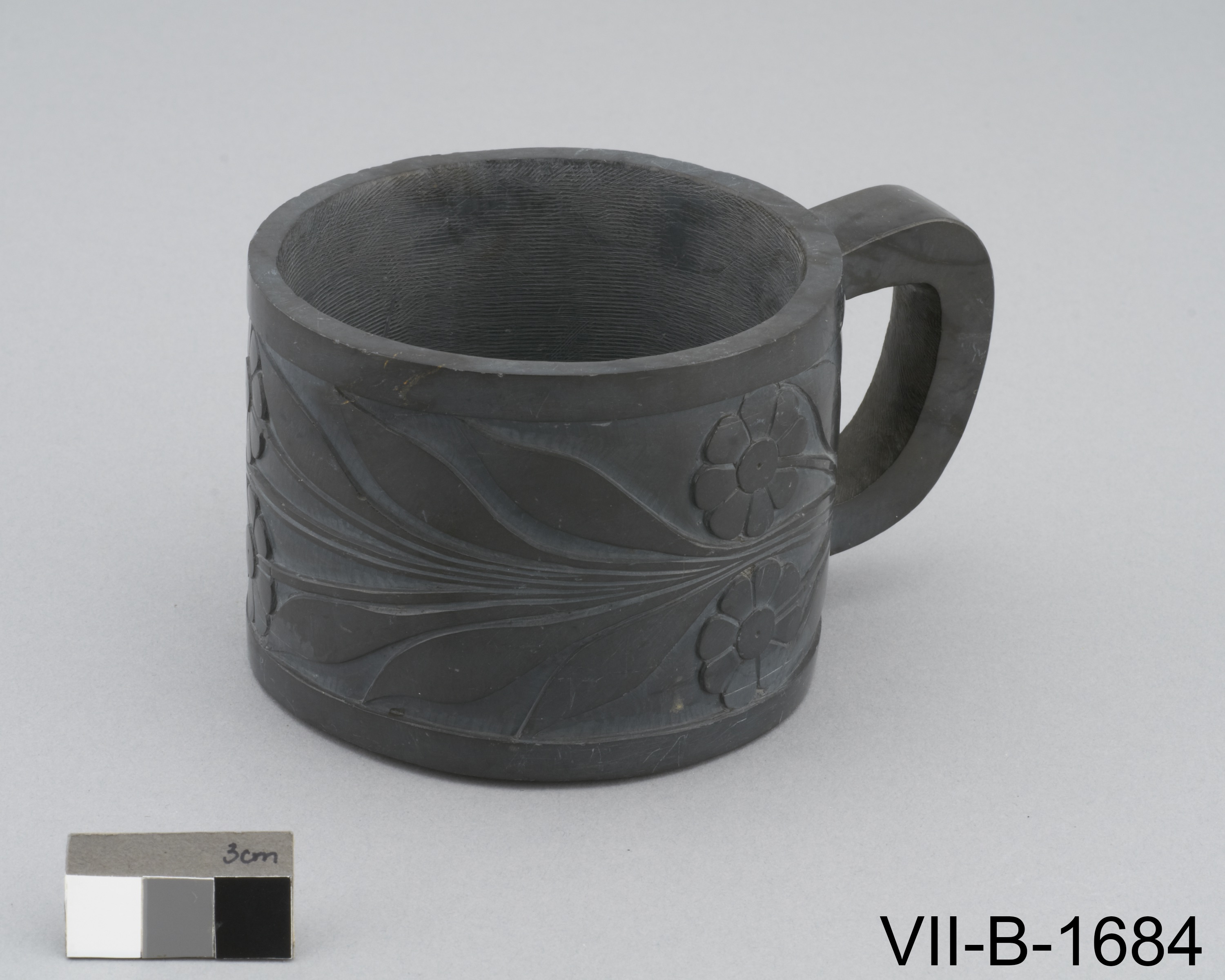 European style coffee cup carved of argillite with flower designs