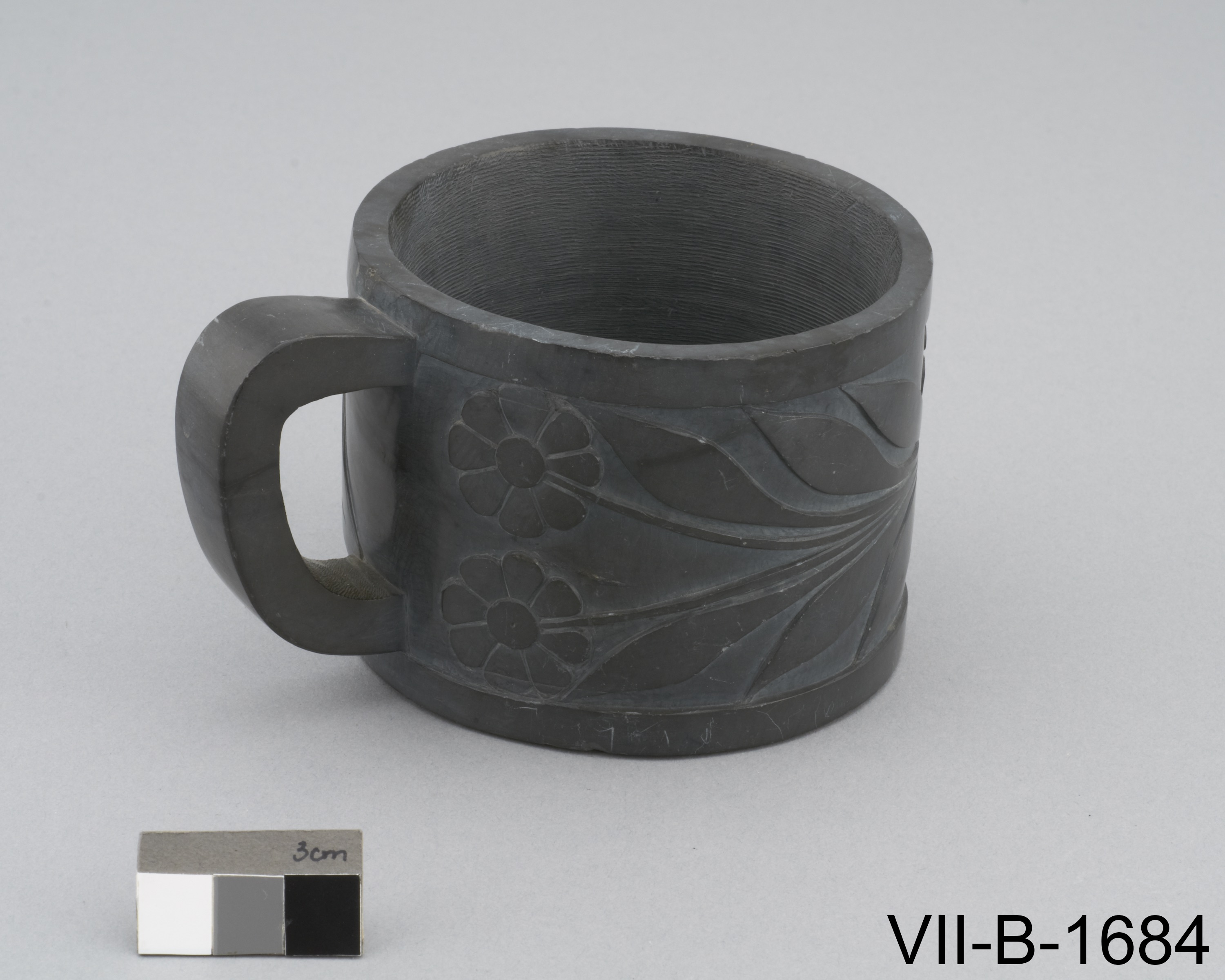 European style coffee cup carved of argillite with flower designs