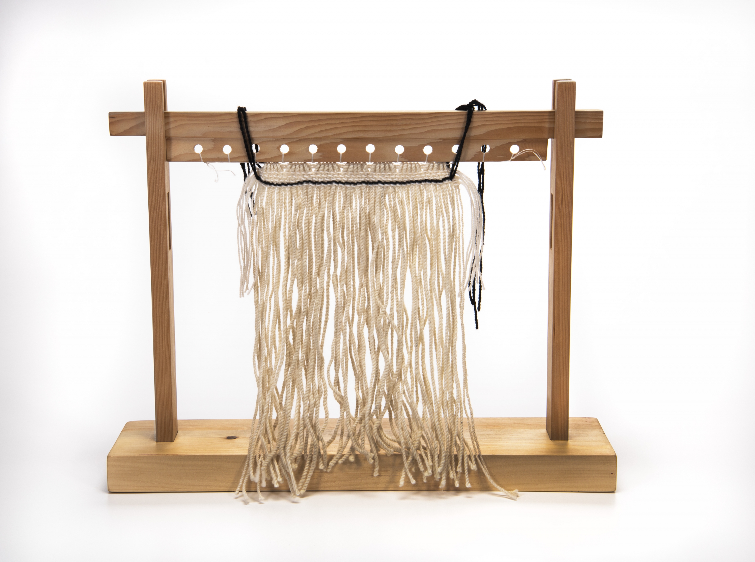 Raven’s Tail textile weaving in progress on a loom