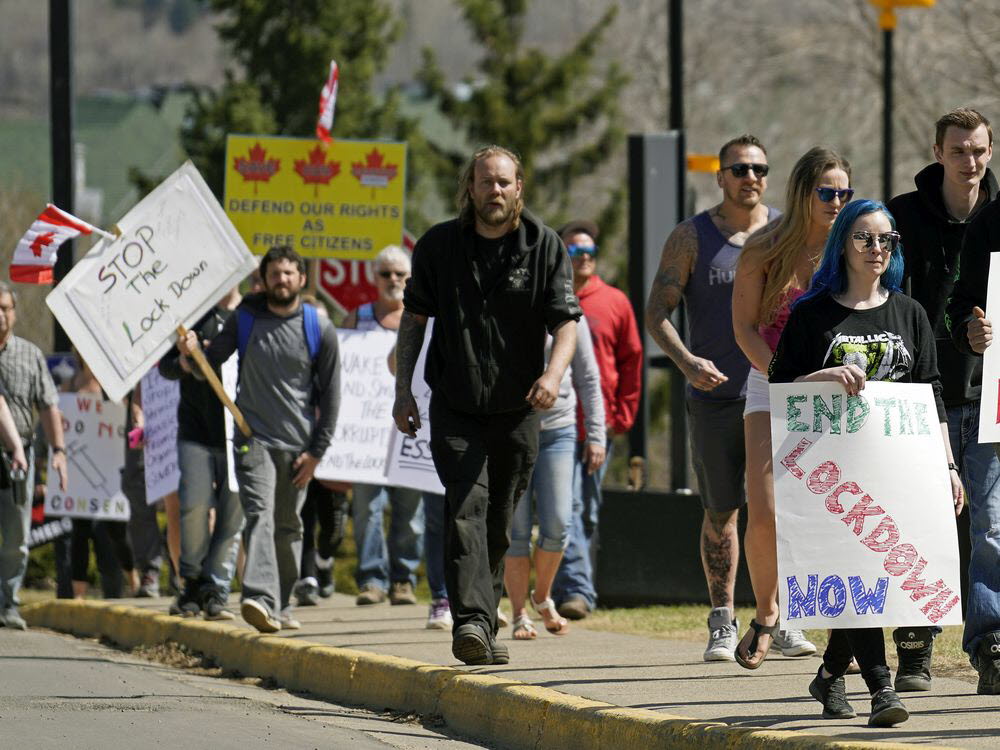 People holding protest signs.