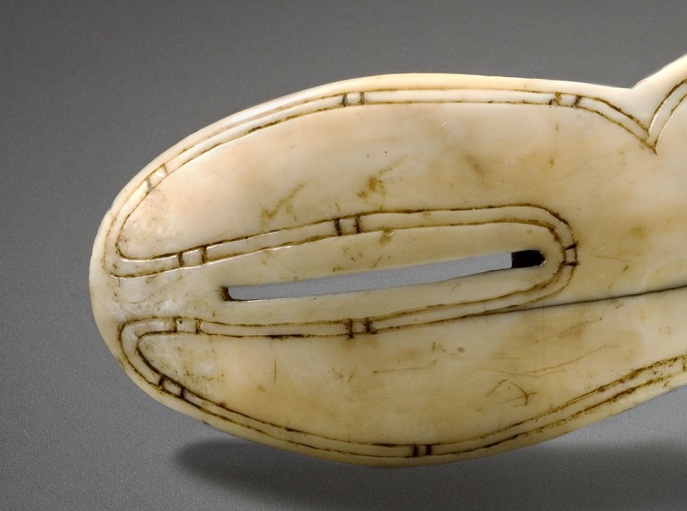 Goggles made of bone with small slits for eyes