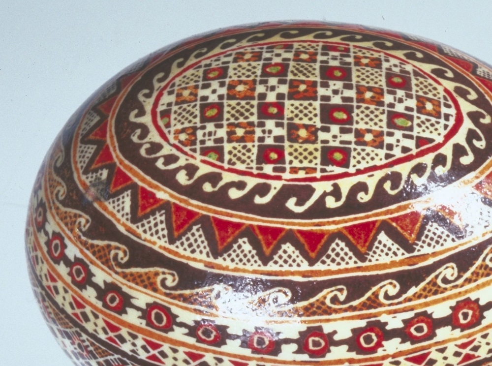 Egg with red, yellow and brown geometric patterns