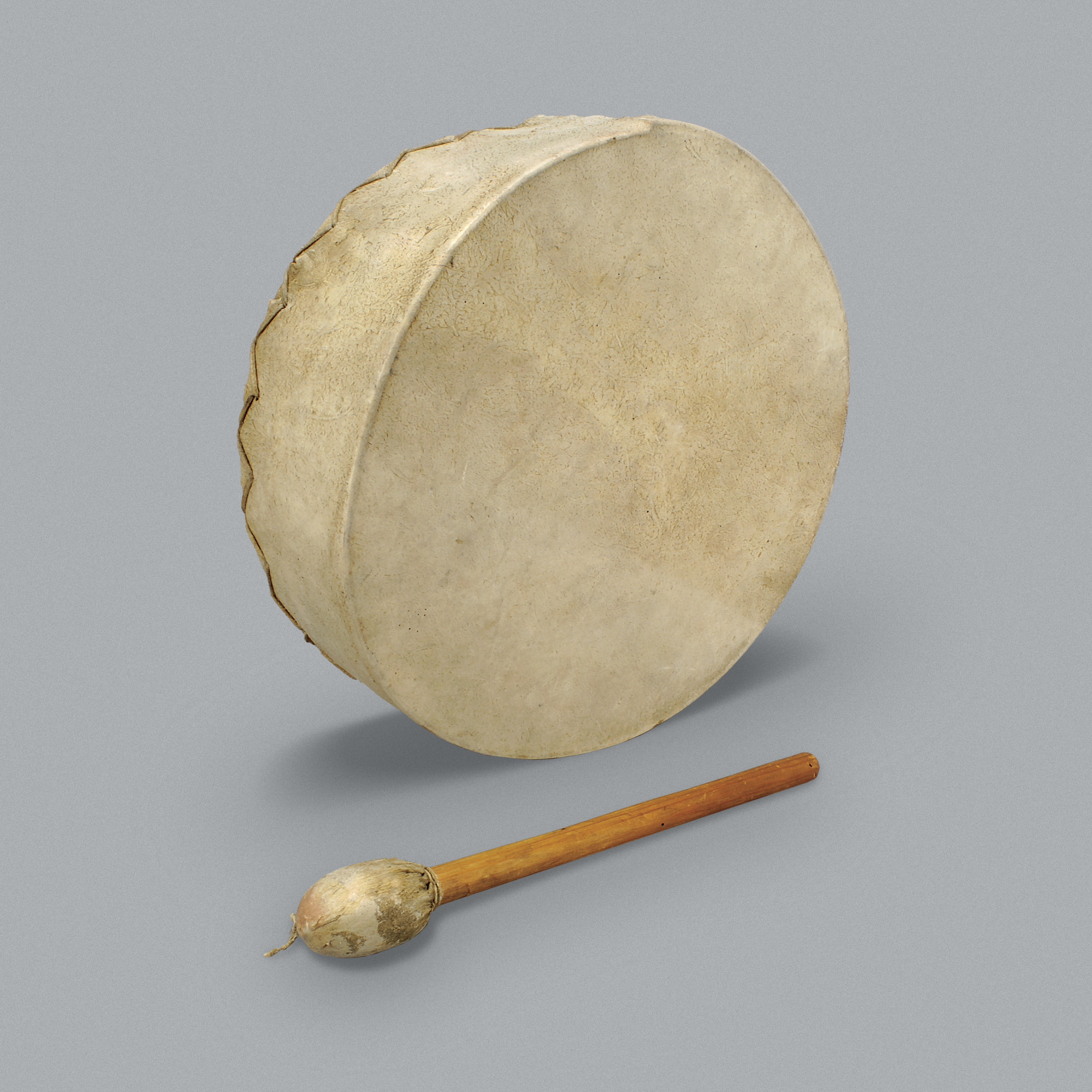 Tambour en peau et batteur.//Skin drum and beater