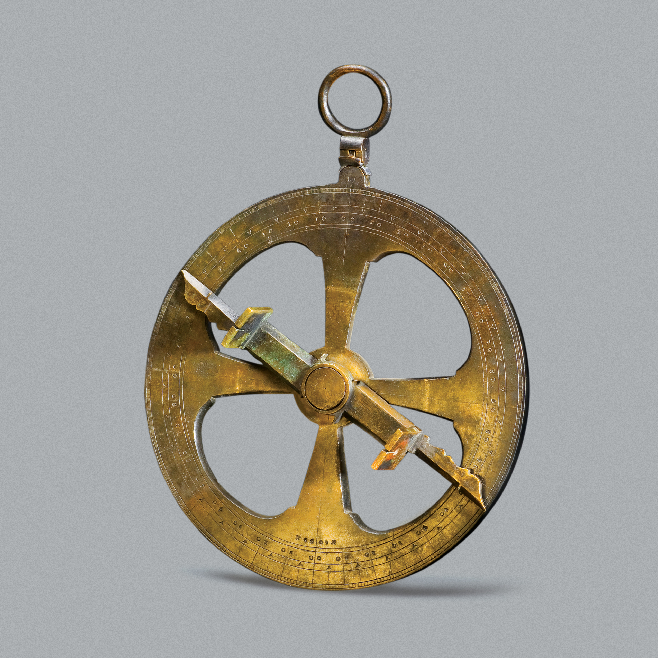 Bronze astrolabe on a white background