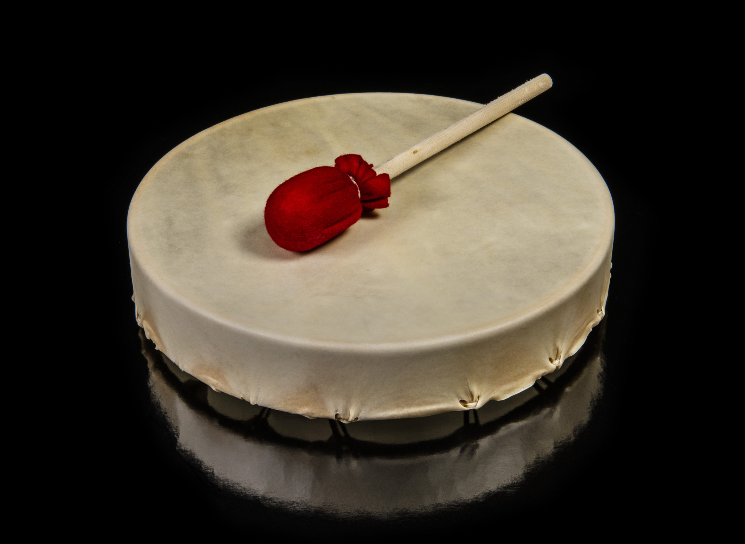 Skin drum with red beater