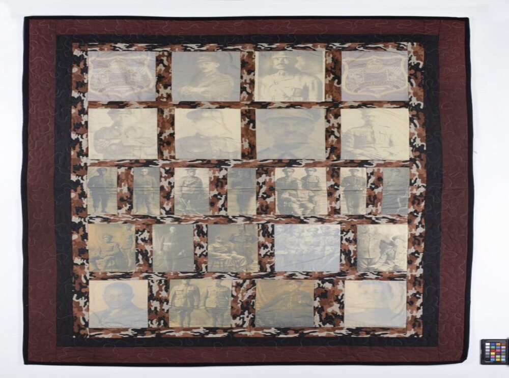 A quilt in brownish tones incorporating text, photographic images, and a frame. - Courtepointe encadrée dans des nuances de brun comportant du texte et des images photographiques.