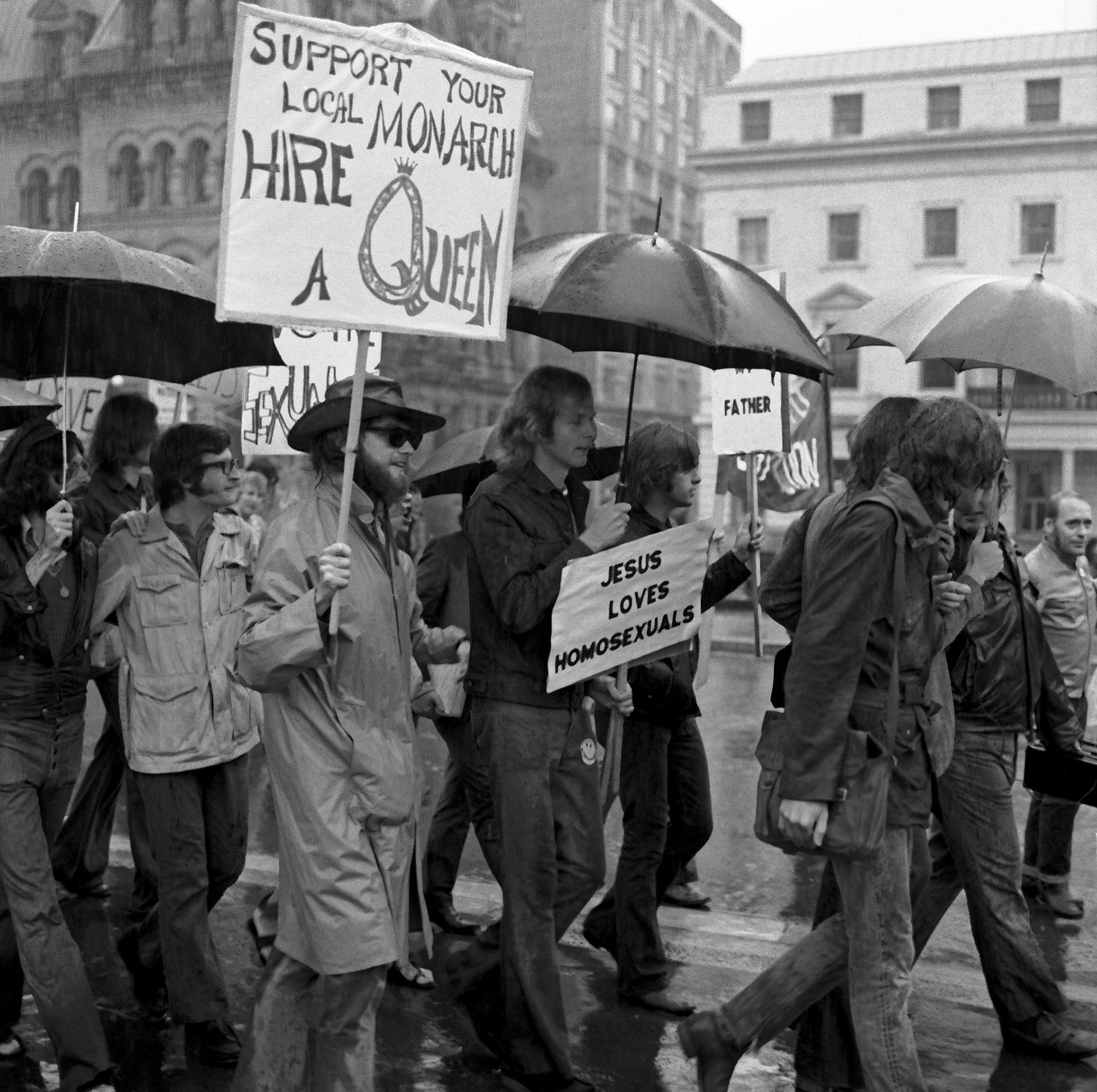 A black-and-white photo of a protest march.